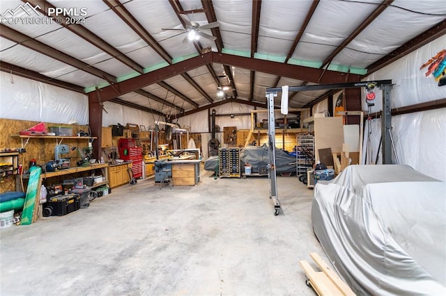 garage with a workshop area and ceiling fan