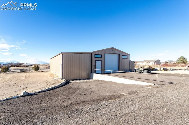 view of outbuilding with a garage