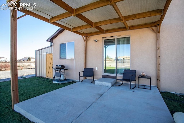 view of patio with a grill