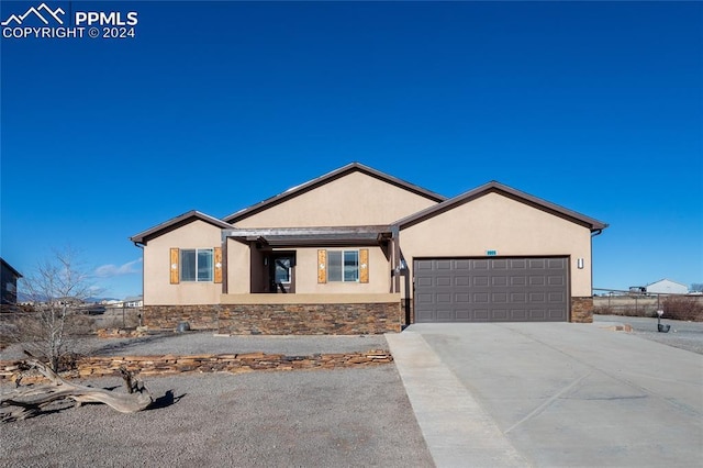 ranch-style house featuring a garage