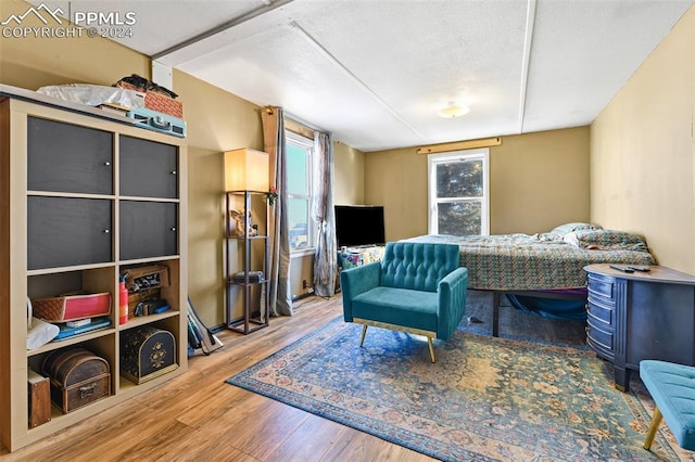 bedroom with wood-type flooring