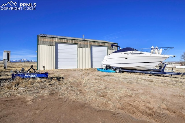 view of outbuilding featuring a garage