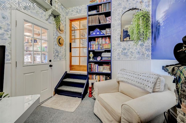 living area featuring carpet floors