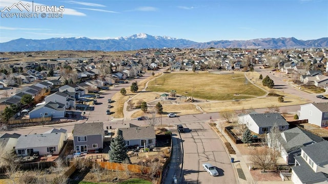 birds eye view of property featuring a mountain view