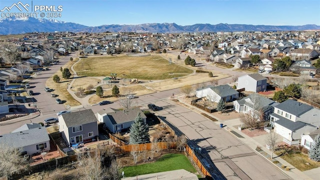 birds eye view of property with a mountain view