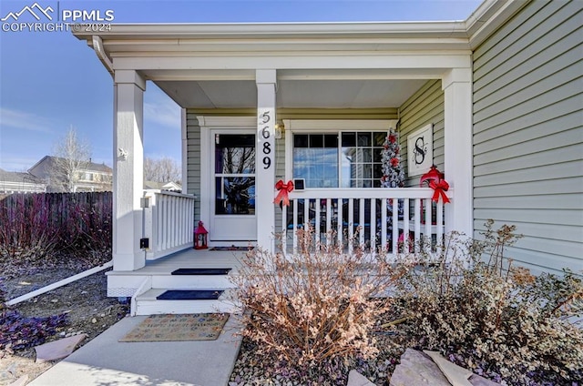 entrance to property featuring a porch