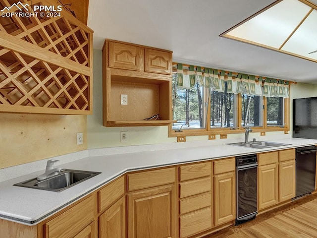 kitchen featuring sink, light brown cabinetry, and light hardwood / wood-style flooring