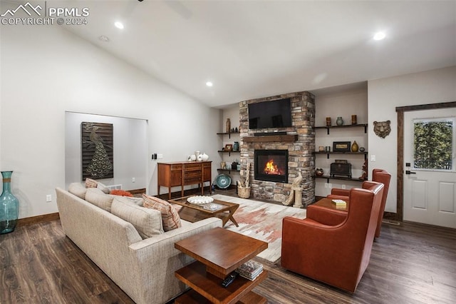 living room with dark hardwood / wood-style flooring, lofted ceiling, and a fireplace