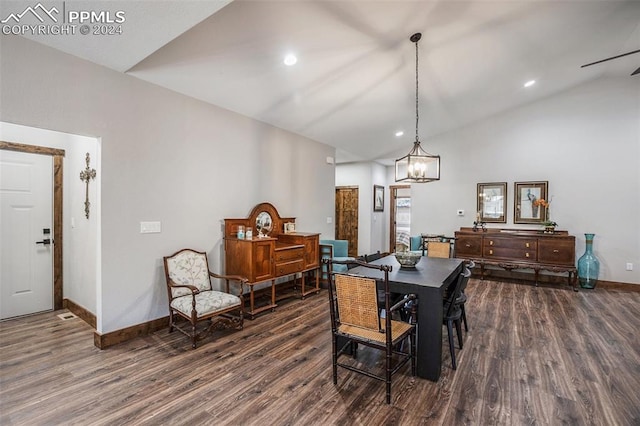 dining area with dark wood-type flooring and high vaulted ceiling