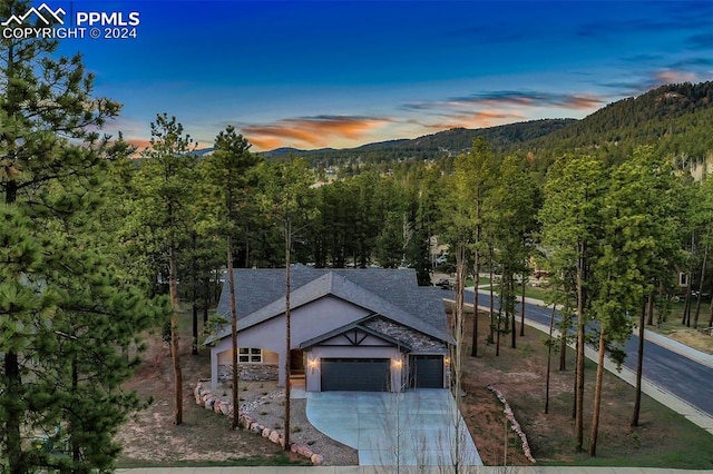 view of front of home featuring a mountain view and a garage