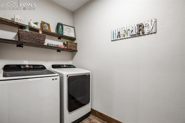 washroom with washing machine and clothes dryer