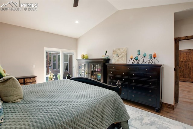 bedroom with access to exterior, ceiling fan, hardwood / wood-style floors, and lofted ceiling