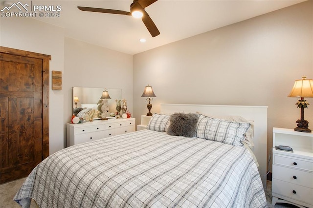 bedroom with ceiling fan and carpet