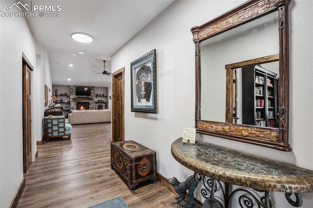 hallway with hardwood / wood-style floors