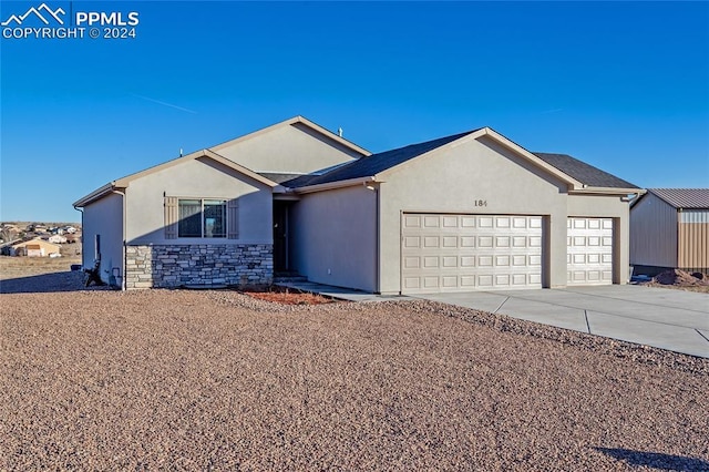 single story home featuring a garage