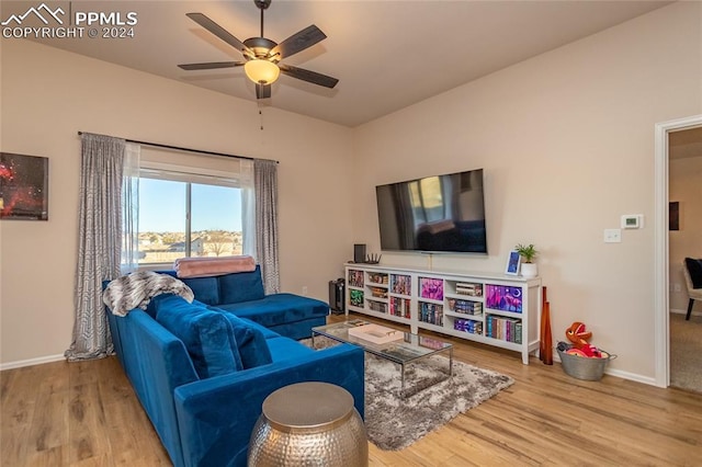 living room with hardwood / wood-style floors and ceiling fan