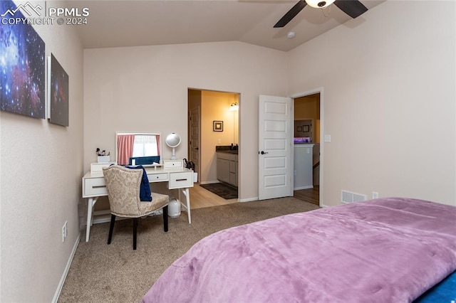 carpeted bedroom with connected bathroom, ceiling fan, and vaulted ceiling