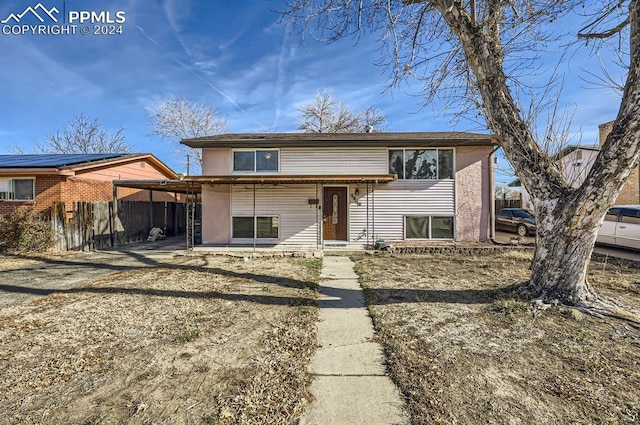 split foyer home with a carport