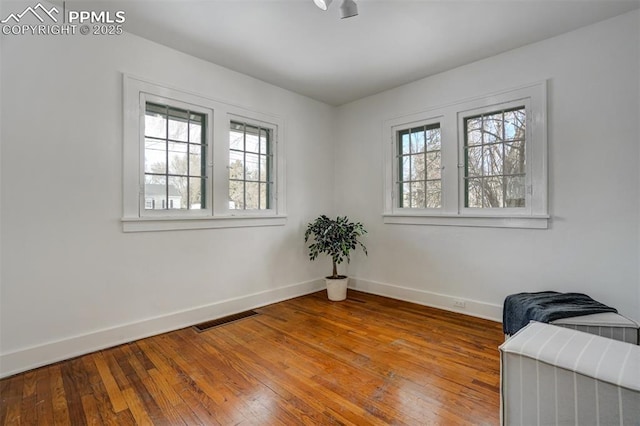 empty room featuring hardwood / wood-style floors