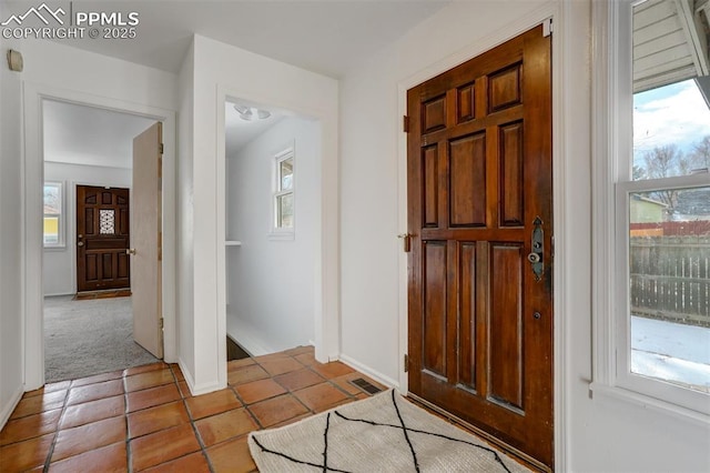 entryway with light carpet