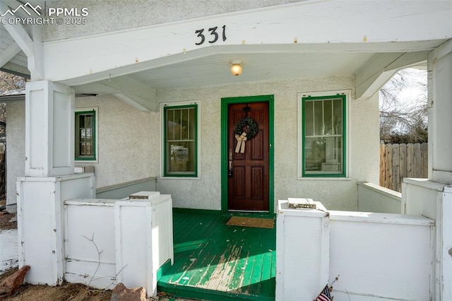 property entrance with covered porch