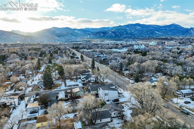 birds eye view of property featuring a mountain view