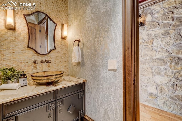 bathroom featuring vanity and wood-type flooring