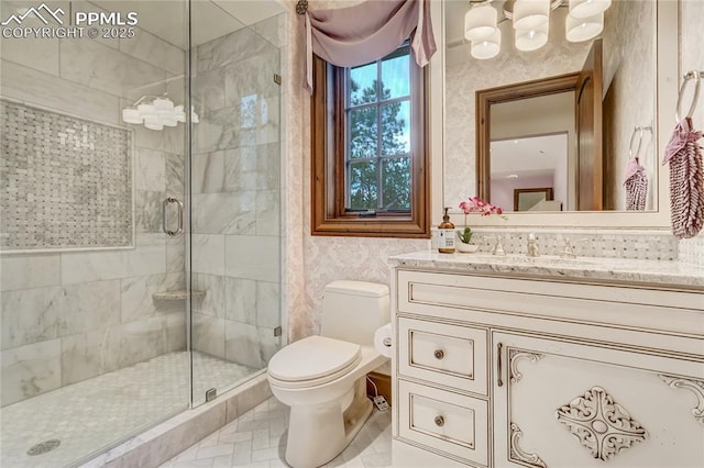 bathroom with vanity, an enclosed shower, and toilet