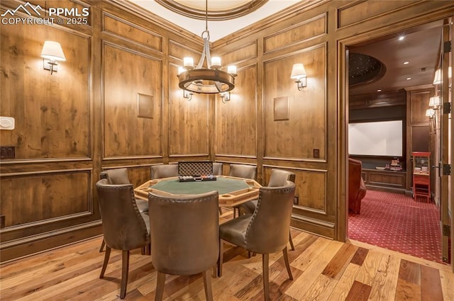 recreation room with light hardwood / wood-style floors and crown molding