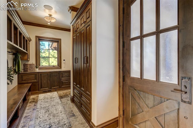 mudroom featuring crown molding