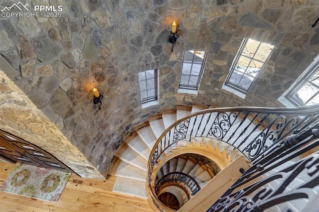 stairs featuring hardwood / wood-style flooring