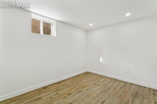 spare room with hardwood / wood-style floors