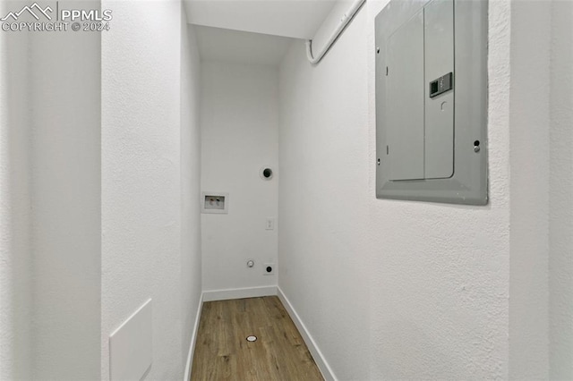 laundry area featuring washer hookup, electric panel, hardwood / wood-style flooring, and electric dryer hookup