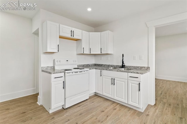 kitchen featuring white range with electric cooktop, light hardwood / wood-style floors, white cabinetry, and sink