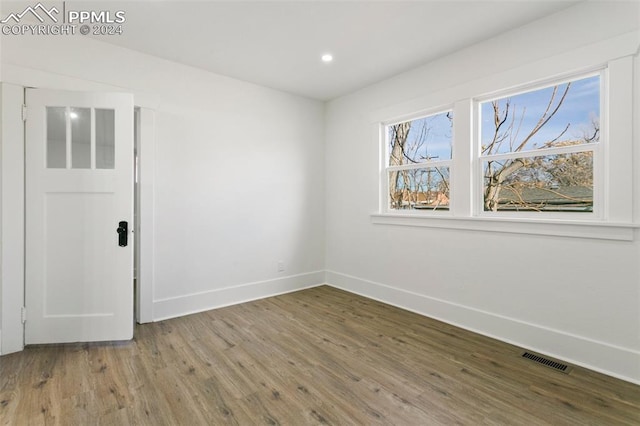 empty room featuring hardwood / wood-style floors