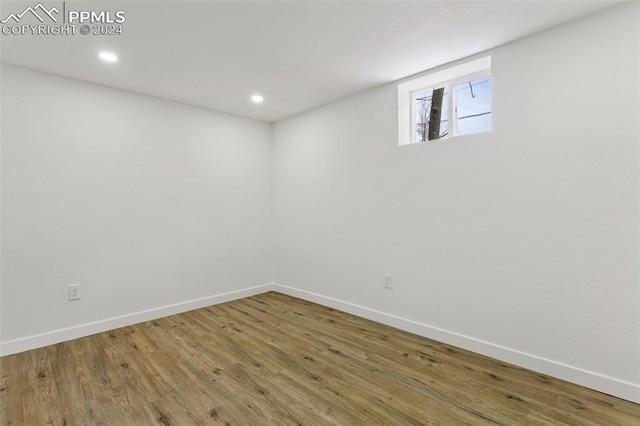 basement featuring hardwood / wood-style flooring