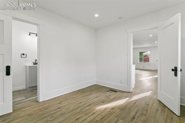 empty room featuring wood-type flooring