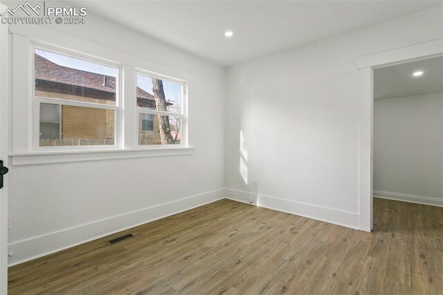 spare room featuring hardwood / wood-style flooring