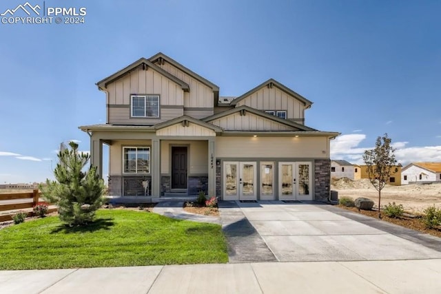 craftsman inspired home with a front yard