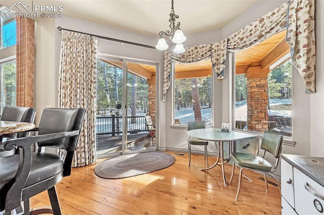 dining room featuring light hardwood / wood-style floors and an inviting chandelier