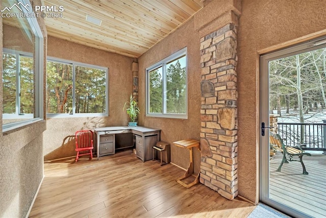 sunroom / solarium featuring wooden ceiling