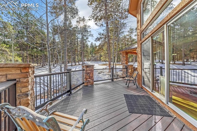 view of snow covered deck