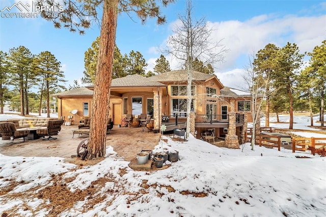 view of snow covered house