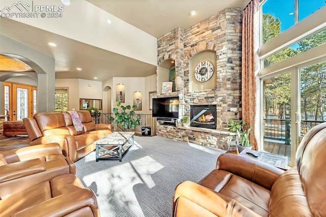 carpeted living room featuring a fireplace