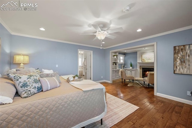 bedroom featuring ceiling fan, dark hardwood / wood-style floors, and ornamental molding