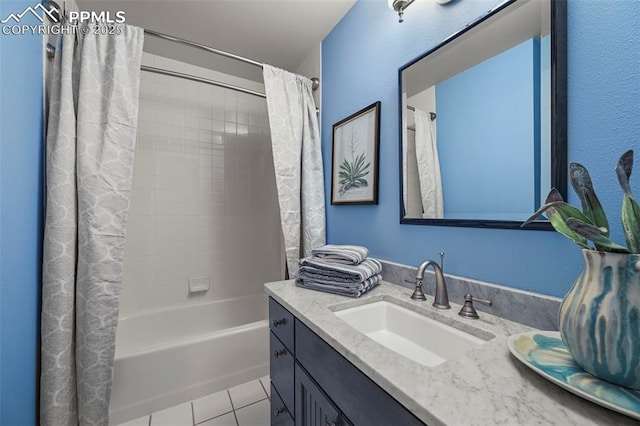 bathroom featuring tile patterned flooring, shower / bath combo, and vanity