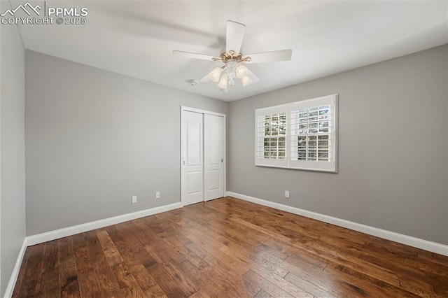 unfurnished bedroom with hardwood / wood-style floors, ceiling fan, and a closet