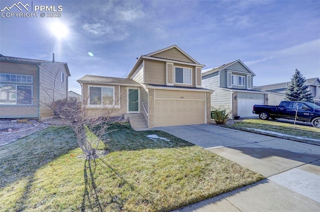 view of front of house with a garage and a front lawn