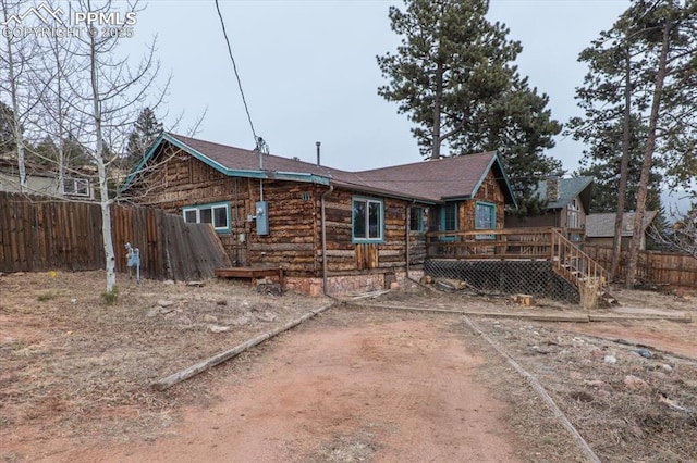 rear view of property with a deck