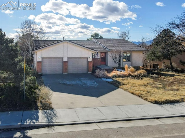 single story home featuring a garage